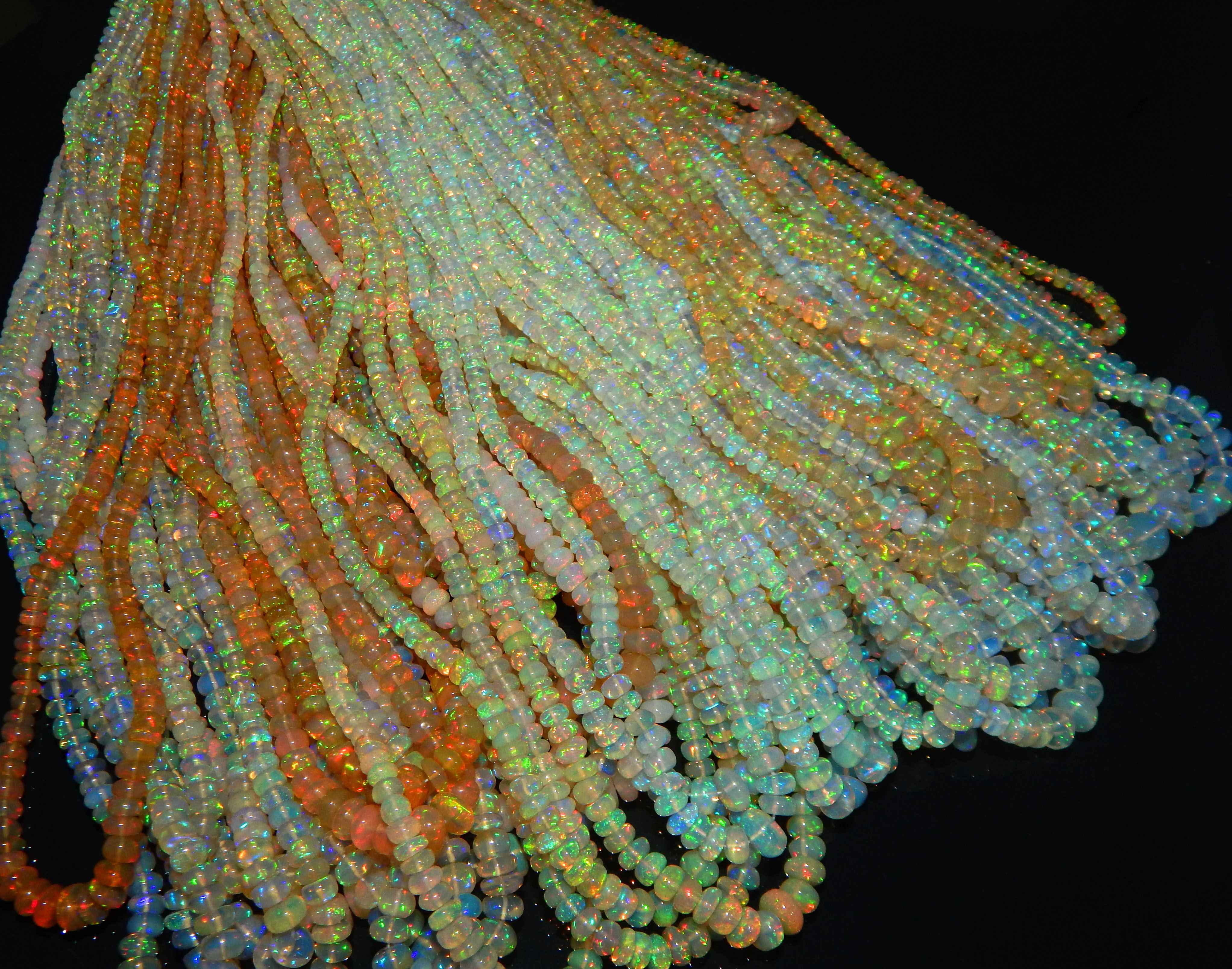 Wholesale natural color play and fire smooth Rondell beads welo Ethiopian opal